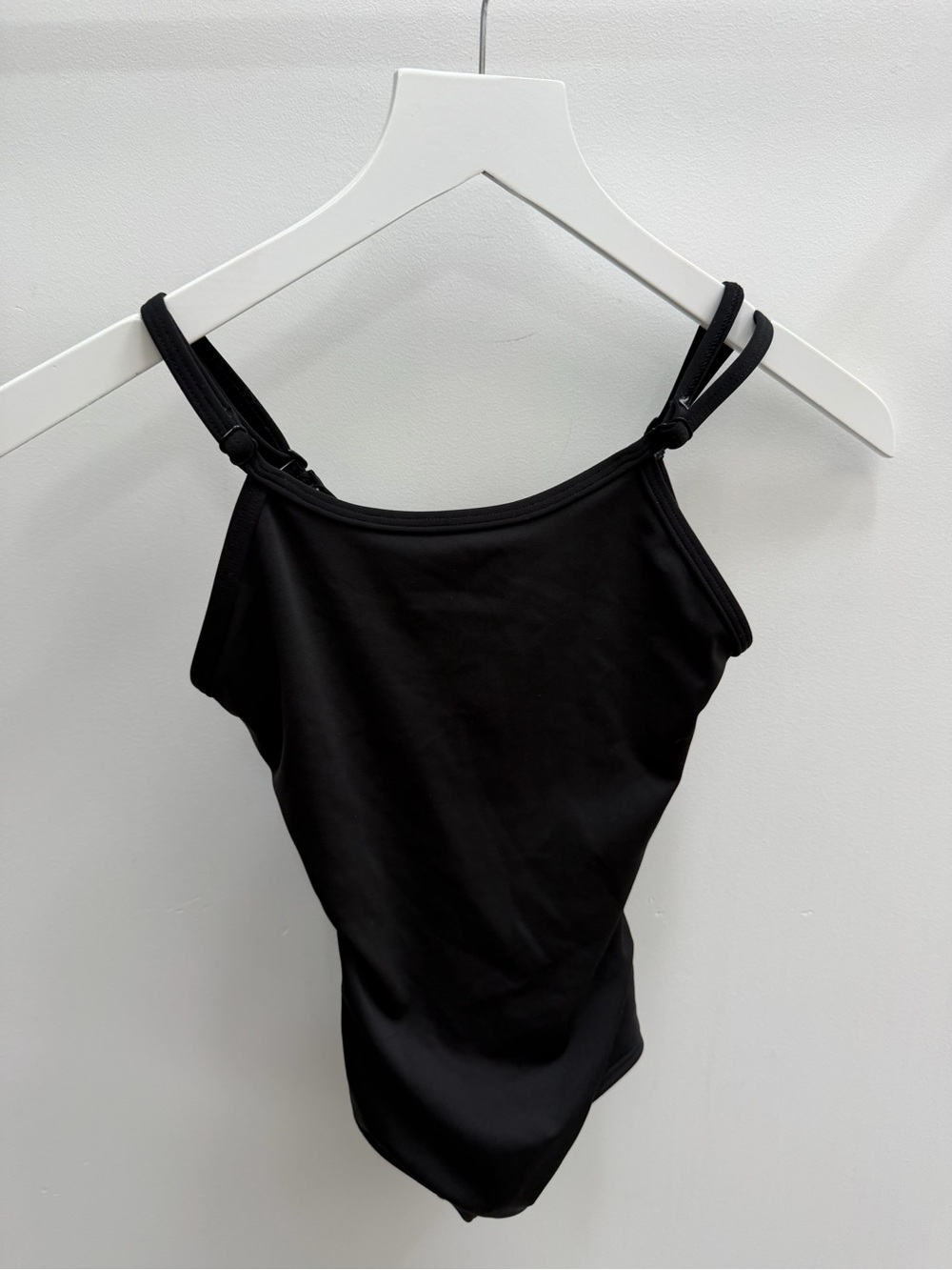 Girl’s black leotard for dance or gymnastics
